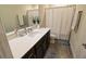 Bright bathroom with modern fixtures, a combination shower and tub, providing comfort and style at 3262 Hanging Tide St, Winter Garden, FL 34787