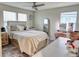 Inviting bedroom featuring a large bed, decor, a ceiling fan and natural light, creating a relaxing atmosphere at 3262 Hanging Tide St, Winter Garden, FL 34787