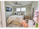 Bright bedroom featuring a TV, bed, and vanity with ample light, perfect for unwinding and getting ready at 3262 Hanging Tide St, Winter Garden, FL 34787