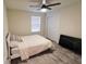 Cozy bedroom with a ceiling fan, a large window and ample space, perfect for relaxation and rest at 3262 Hanging Tide St, Winter Garden, FL 34787