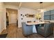Contemporary dining room features a modern light fixture, stylish furnishings, and plank flooring at 3262 Hanging Tide St, Winter Garden, FL 34787