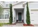 Inviting home entrance with stylish front door, side lights, paved walkway, and verdant landscaping at 3262 Hanging Tide St, Winter Garden, FL 34787