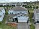 Charming two-story home featuring a two-car garage, a beautifully landscaped front yard, and a welcoming entrance at 3262 Hanging Tide St, Winter Garden, FL 34787