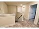 Hallway with stylish flooring that leads to another staircase, adding a stylish touch to the interior design at 3262 Hanging Tide St, Winter Garden, FL 34787