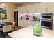 Bright kitchen featuring modern appliances, sleek white cabinetry, and an adjacent dining area with stylish decor at 3262 Hanging Tide St, Winter Garden, FL 34787