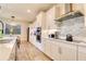 Spacious kitchen with stainless appliances, modern lighting, sleek countertops, and ample white cabinetry at 3262 Hanging Tide St, Winter Garden, FL 34787