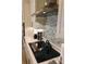 Modern kitchen with stainless steel appliances, elegant backsplash, sleek countertops, and ample cabinet space at 3262 Hanging Tide St, Winter Garden, FL 34787