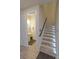 Bright staircase with LED lighting leads to a powder room, adding a touch of elegance and practicality to the home at 3262 Hanging Tide St, Winter Garden, FL 34787