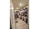 Large walk-in closet with ample storage and organizational features at 3262 Hanging Tide St, Winter Garden, FL 34787