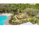 Beautiful aerial view of the community mini-golf and pool area, surrounded by lush landscaping at 426 Captiva Dr, Davenport, FL 33896
