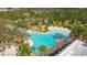 A gorgeous, enormous community pool features ample space for relaxing and socializing at 426 Captiva Dr, Davenport, FL 33896