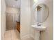 Bathroom featuring a pedestal sink, tile flooring, and glass-enclosed shower at 426 Captiva Dr, Davenport, FL 33896