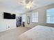 Bright bedroom featuring a ceiling fan, closet, and two windows at 426 Captiva Dr, Davenport, FL 33896