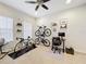 Bedroom with a ceiling fan, multiple bikes, and a desk at 426 Captiva Dr, Davenport, FL 33896