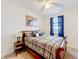 Bedroom featuring a ceiling fan, blue curtains, and a queen sized bed at 426 Captiva Dr, Davenport, FL 33896