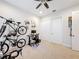Bedroom with a ceiling fan, multiple bikes, closet and a desk at 426 Captiva Dr, Davenport, FL 33896