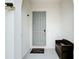 Welcoming entryway featuring a neutral door, a bench, and a 'Welcome to our home' doormat at 426 Captiva Dr, Davenport, FL 33896