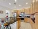 Bright kitchen featuring stainless steel appliances, black granite countertops and bar stool seating at 426 Captiva Dr, Davenport, FL 33896
