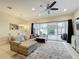 Bright, spacious living room with comfortable seating and sliding doors to outdoor patio with pool view at 426 Captiva Dr, Davenport, FL 33896