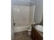 Standard bathroom featuring a shower-tub combination and a single sink vanity with tile flooring at 4406 Hidden Meadow Dr, Kissimmee, FL 34746