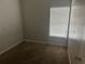 A simple bedroom with minimal fixtures and a window offering natural light at 4406 Hidden Meadow Dr, Kissimmee, FL 34746