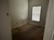 A simple bedroom with minimal fixtures and a window offering natural light at 4406 Hidden Meadow Dr, Kissimmee, FL 34746