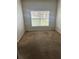 Empty bedroom featuring carpeted flooring and a window at 4406 Hidden Meadow Dr, Kissimmee, FL 34746