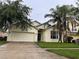 Charming single-Gathering home with a well-maintained lawn and a two-car garage at 4406 Hidden Meadow Dr, Kissimmee, FL 34746
