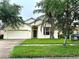 Charming single-Gathering home with a well-maintained lawn and a two-car garage at 4406 Hidden Meadow Dr, Kissimmee, FL 34746