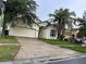 Charming single-Gathering home with a well-maintained lawn and a two-car garage at 4406 Hidden Meadow Dr, Kissimmee, FL 34746