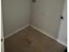 The simple laundry room features tile floors, and utility hook ups at 4406 Hidden Meadow Dr, Kissimmee, FL 34746
