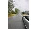 View of the quiet street with well-maintained sidewalks and mature trees at 4406 Hidden Meadow Dr, Kissimmee, FL 34746