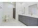 Bathroom featuring double vanity with stone countertops, a glass shower, and a toilet at 4491 Sw 151 St, Ocala, FL 34473
