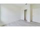 Bedroom with a light gray vinyl floor, closet and access door at 4491 Sw 151 St, Ocala, FL 34473