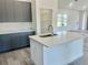 Charming kitchen with a spacious island, pantry and contemporary cabinets at 4491 Sw 151 St, Ocala, FL 34473