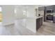 Bright open-concept kitchen and living area with modern finishes and ample natural light at 4491 Sw 151 St, Ocala, FL 34473