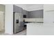 Stylish kitchen featuring stainless steel appliances and ample cabinet space at 4491 Sw 151 St, Ocala, FL 34473