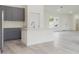 Modern kitchen boasts sleek gray cabinets and a pristine white center island, perfect for meal preparation at 4491 Sw 151 St, Ocala, FL 34473