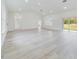 Bright, expansive living area with high ceilings and sliding glass doors to outdoor space at 4491 Sw 151 St, Ocala, FL 34473