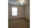 A room with a standard window and carpeted floor is ready for personalization at 4710 Willoughby St, Kissimmee, FL 34758
