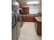 Close-up of kitchen featuring stainless steel appliances, and wood cabinets at 4710 Willoughby St, Kissimmee, FL 34758