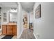 Hallway with bathroom access and view of a bedroom featuring a baby gate at 4740 Cypress Forest Ln, St Cloud, FL 34772