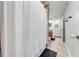 Functional bathroom featuring a walk-in shower, wood paneling, tiled floors, and a neutral color scheme at 4740 Cypress Forest Ln, St Cloud, FL 34772