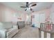 Cozy Bedroom featuring soft pink walls, neutral carpet, and a changing table with dresser at 4740 Cypress Forest Ln, St Cloud, FL 34772