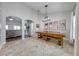 Bright dining room with a long wooden table and bench seating at 4740 Cypress Forest Ln, St Cloud, FL 34772