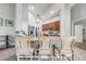 Kitchen featuring breakfast bar with chairs, stainless appliances, and tile floor at 4740 Cypress Forest Ln, St Cloud, FL 34772
