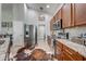 Modern kitchen with stainless steel appliances, granite countertops, and stylish tile backsplash at 4740 Cypress Forest Ln, St Cloud, FL 34772