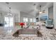 Modern kitchen with a sink, granite countertops, and views into other living spaces at 4740 Cypress Forest Ln, St Cloud, FL 34772