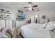 Comfortable main bedroom featuring neutral tones, a ceiling fan, and stylish decor at 4740 Cypress Forest Ln, St Cloud, FL 34772