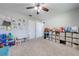 Functional playroom design with ample storage, play areas, and soft carpet, offering a -friendly environment at 4740 Cypress Forest Ln, St Cloud, FL 34772
